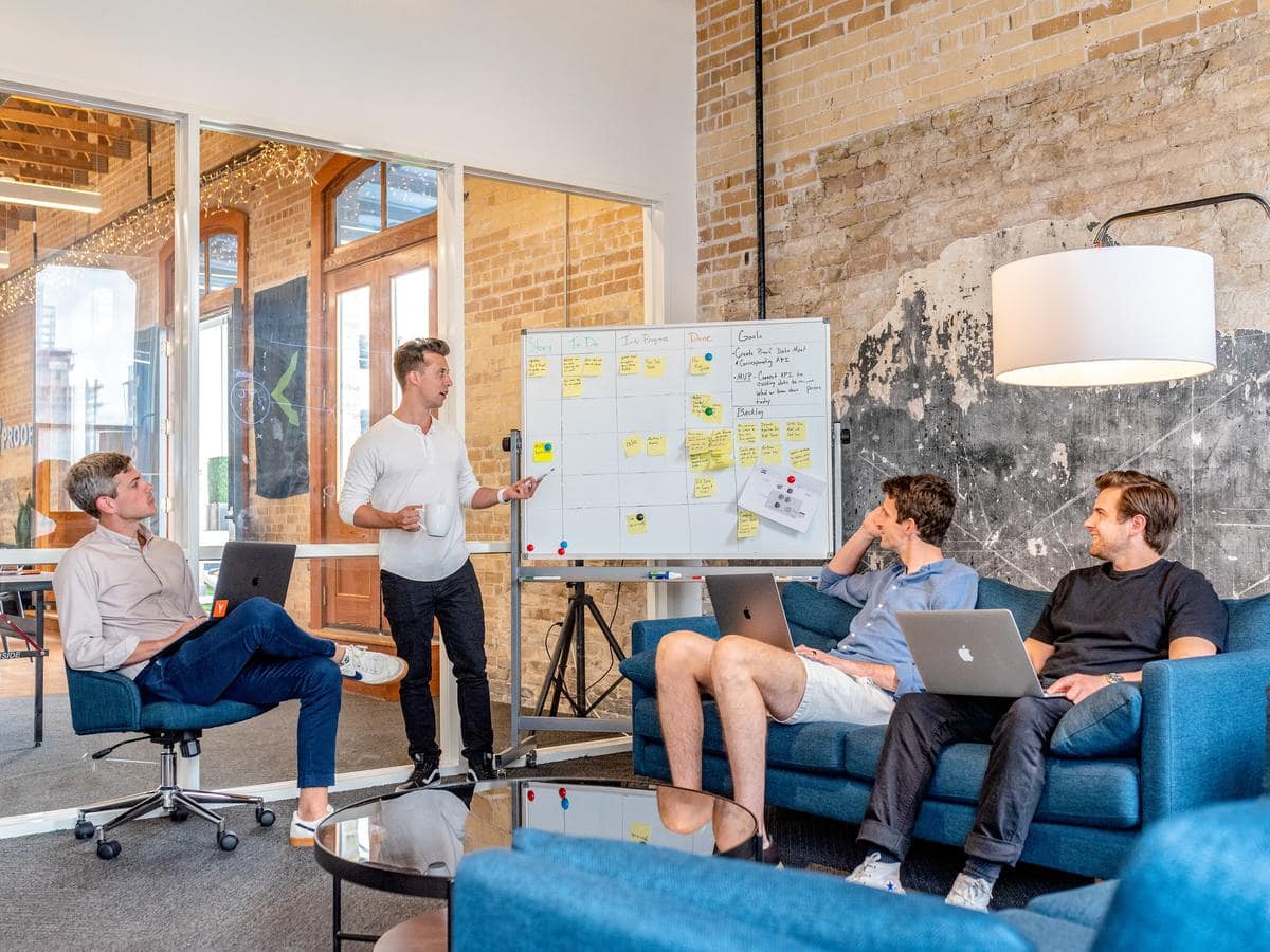 4 men holding meeting