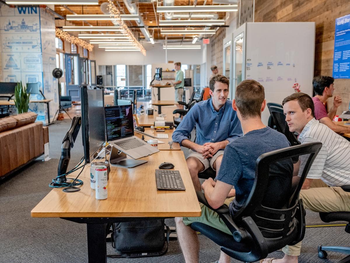 Men talking in office