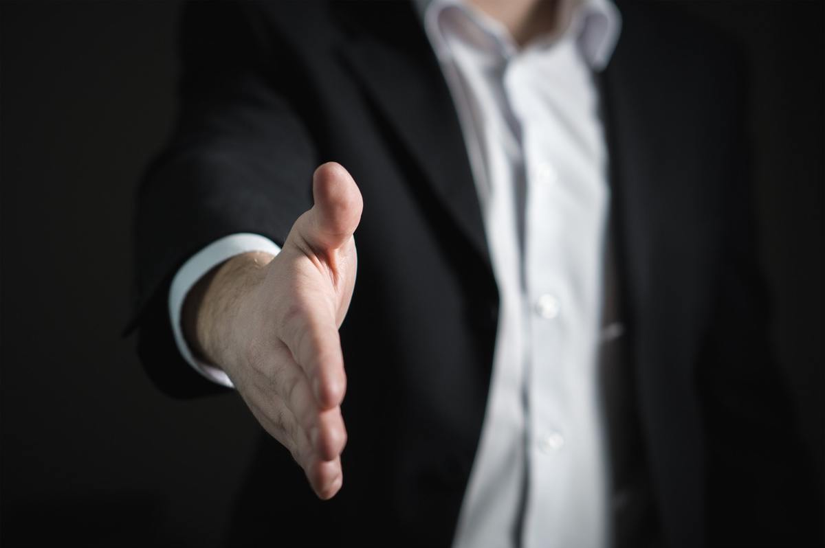 Man initiating handshake