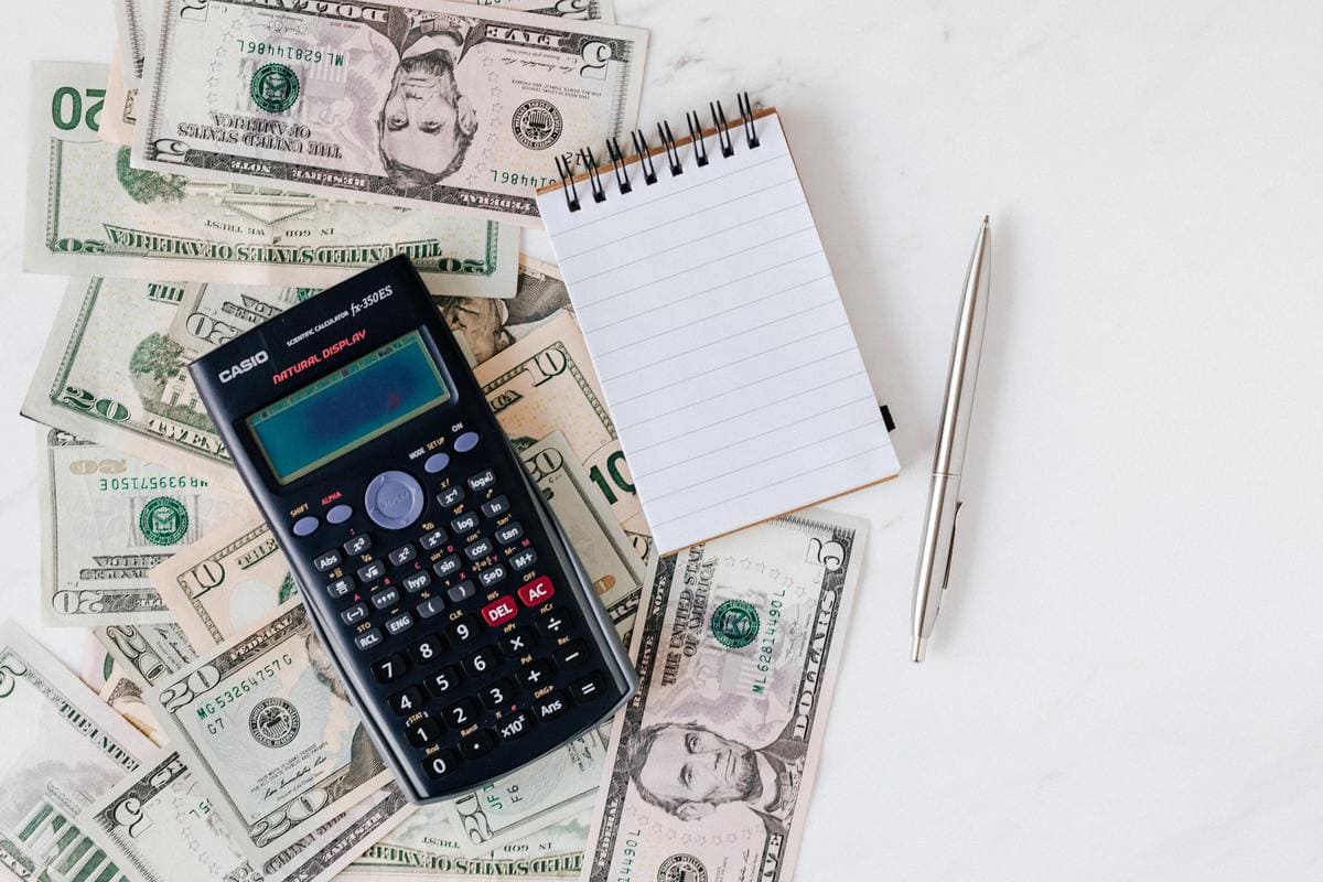 Calculator on top dollar bills