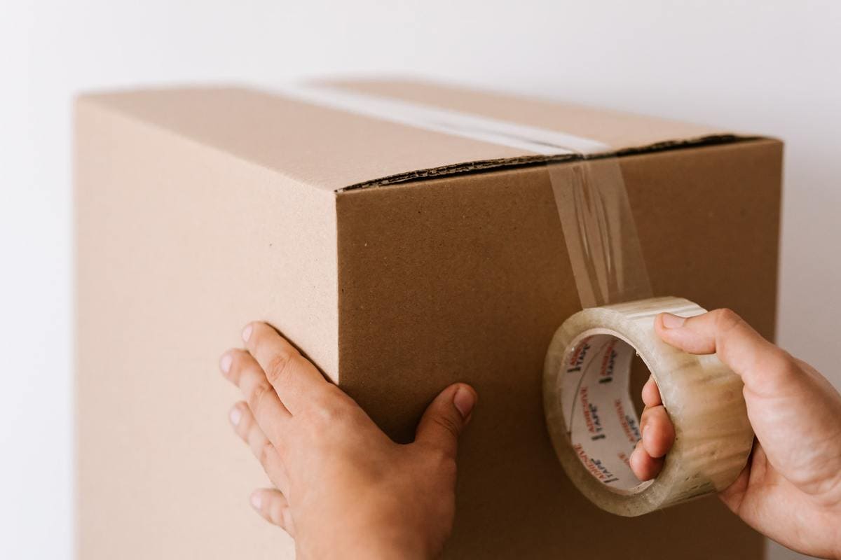 Man taping box