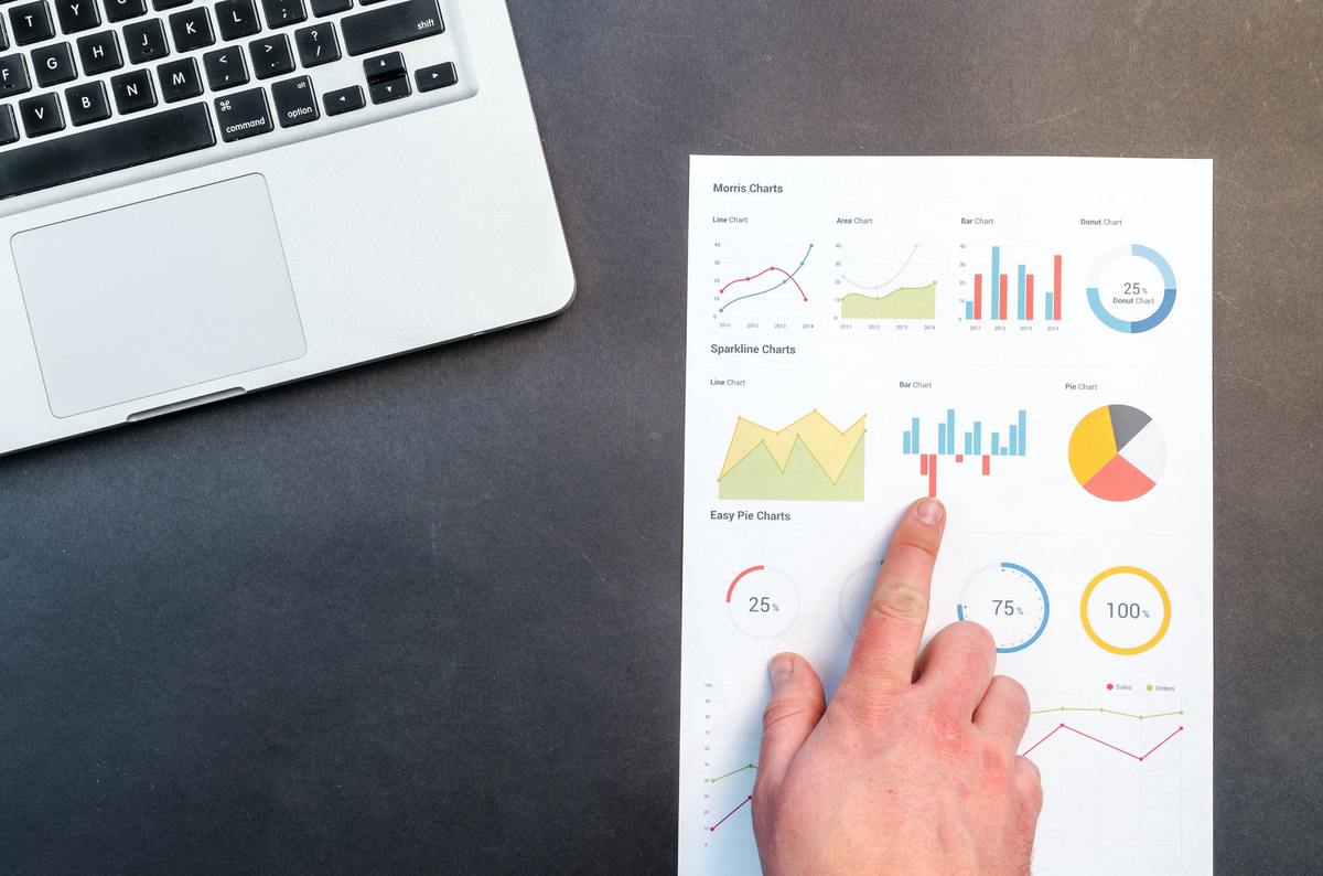 Person pointing at printed chart