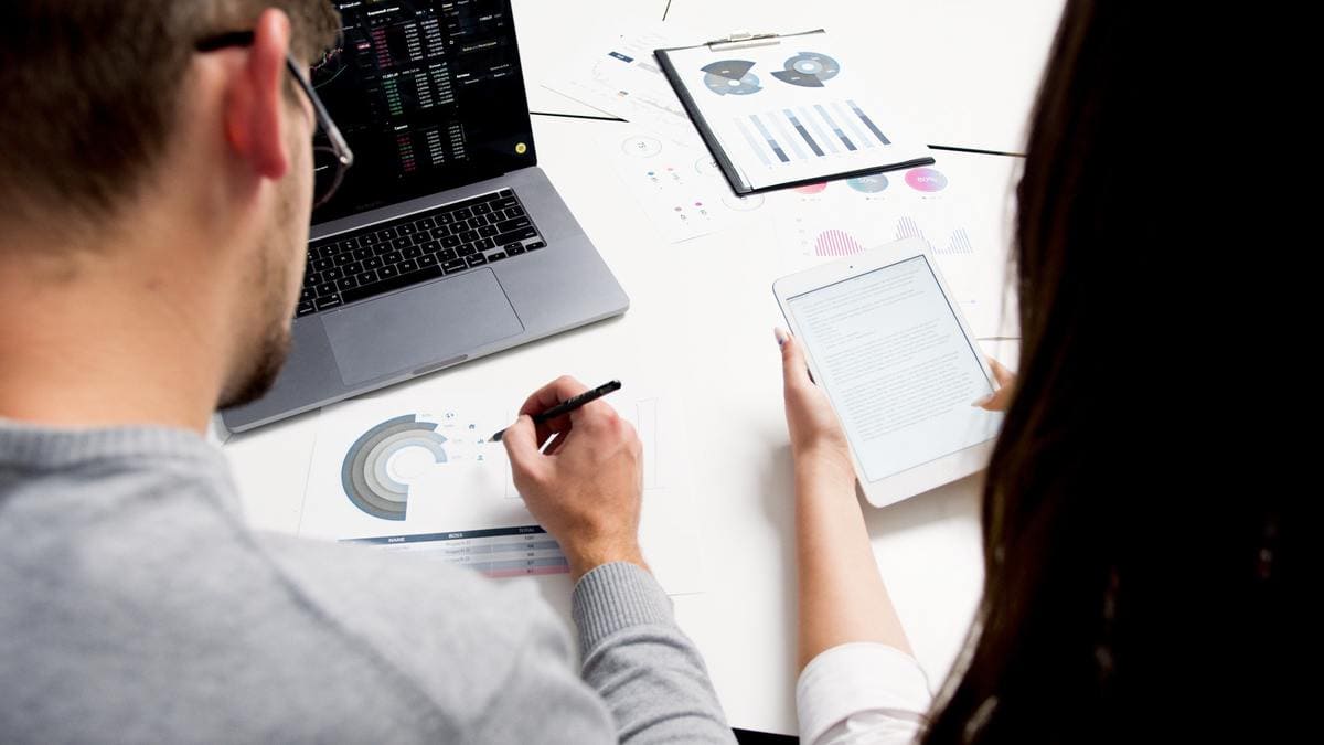 Two people analyzing data