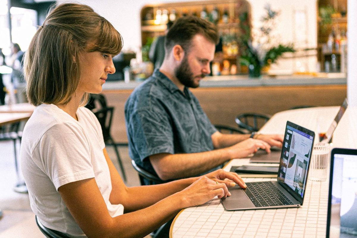 girl looking at the photos on laptop
