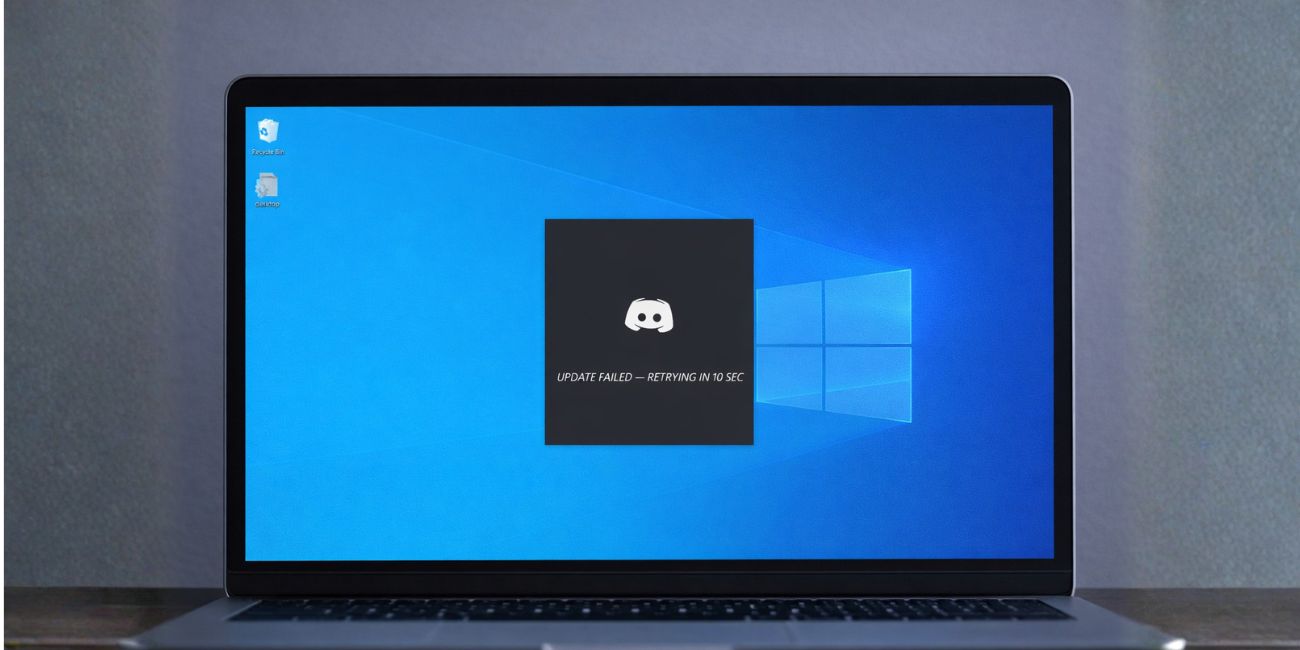 Discord app on a Windows laptop showing an “Update Failed” loop message on the screen